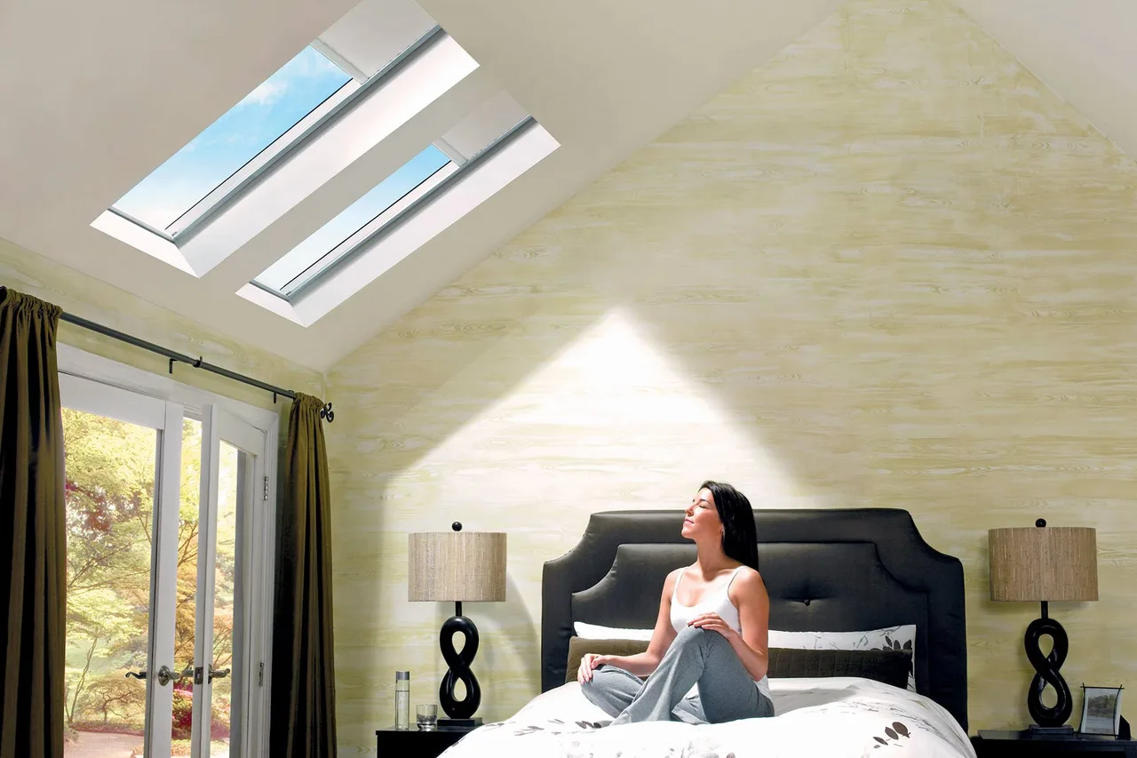 Two roof windows above a bright bedroom